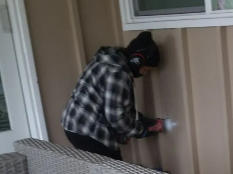 Professional electrician installing an exterior outlet in Hanover